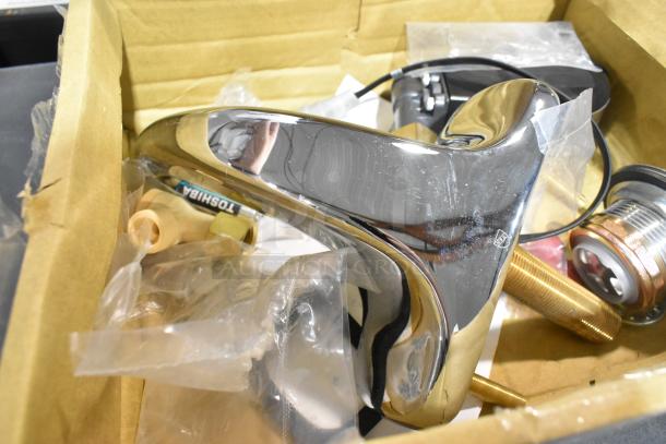 Brand new Zurn Elkay Z6915-XL sensor faucet, chrome finish, 4" centers, 6 3/4" spout, battery-powered, minor scratches.