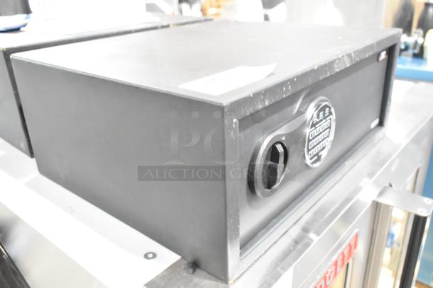 BRAND NEW scratch and dent black steel security safe by 360 Office Furniture. Dimensions 19 3/4" x 16" x 7 7/8". Features electronic keypad lock. Appears in excellent condition despite minor blemishes.
