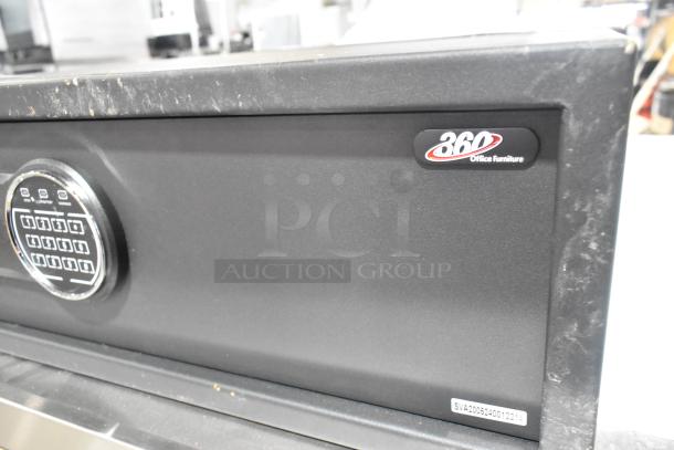 Brand new 360 Office Furniture black steel security safe, 19 3/4" x 16" x 7 7/8", with electronic keypad; minor scratches.