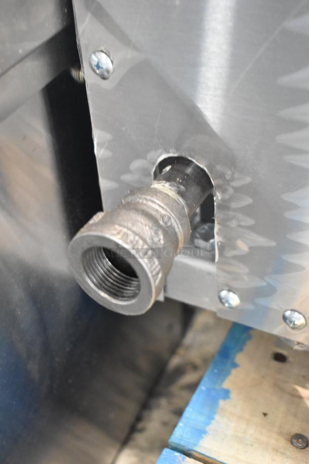 "US Range SUMG-100 gas connection detail, visible scratches on stainless steel, part of 2025 Summit Series oven."