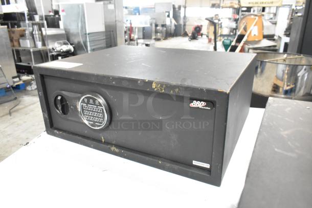 Brand new 360 Office Furniture black steel security safe, 19 3/4"x16"x7 7/8", with electronic keypad lock; has scratches.