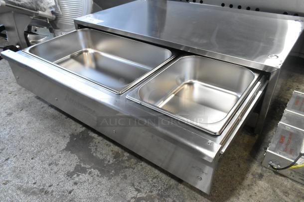 Brand new Avantco 177BW48 stainless steel hot dog bun warmer with dual compartments, 120V, showing minor scratches.