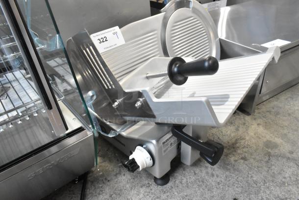 Brand new 2025 Bizerba GSE 12 slicer, 12" blade, manual gravity feed, 120V, scratch and dent, auction tag visible.