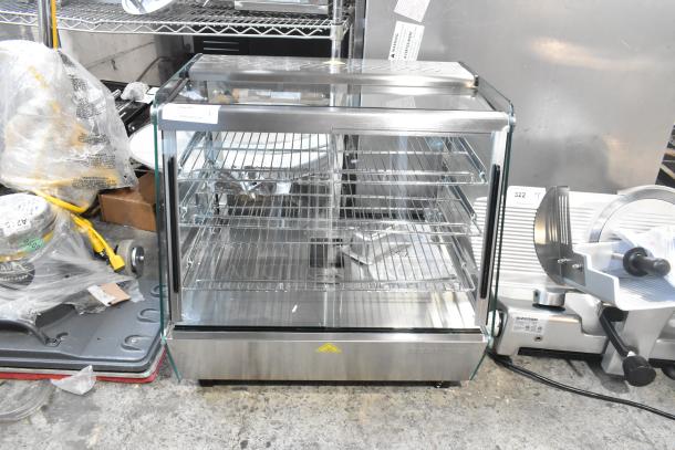 Brand new ServIt 423HDM26SA 26" heated display case with three shelves, sliding doors, and 120V, 1-phase power.