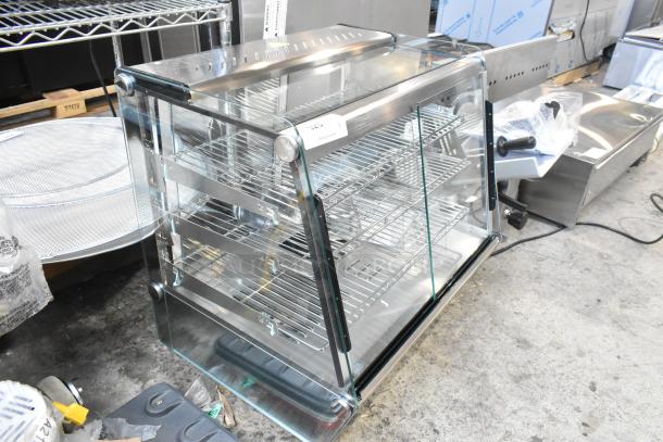 Brand new ServIt 423HDM26SA 26" heated display case, 3 shelves, glass sliding doors, 120V, minor scratches, countertop model.