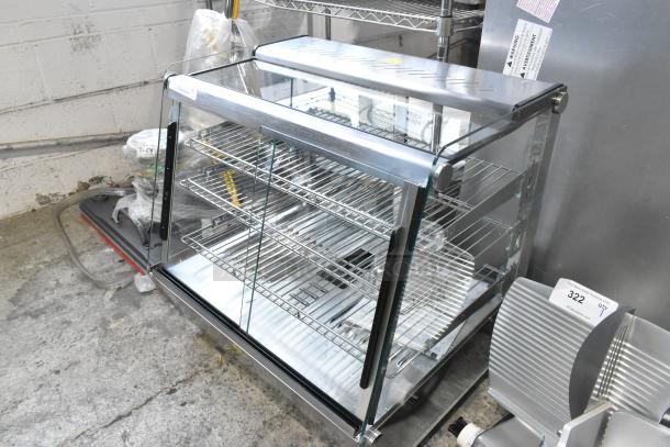 Brand new ServIt 26" heated display case, model 423HDM26SA, with sliding doors and three shelves, 120V, 1 Phase.