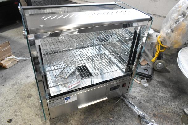 Brand new ServIt 423HDM26SA 26" heated display case, 3 shelves, sliding doors, 120V, clear glass sides, stainless steel.