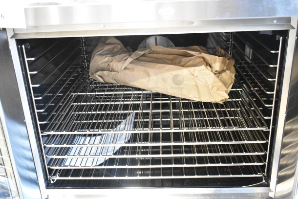 Brand new Blodgett ZEPHAIRE-200-E electric convection oven, stainless steel, oven racks, 208 volts, 1 phase, visible draft diverter.