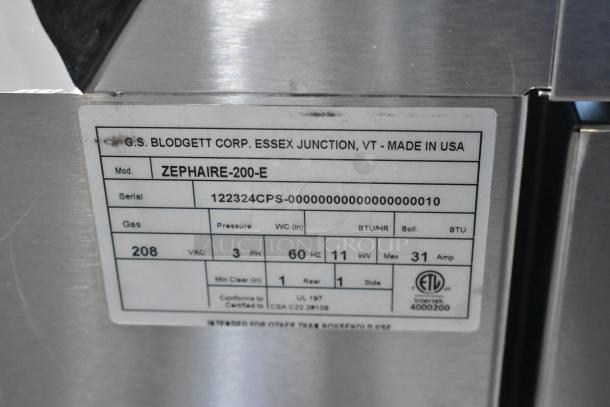 Label showing Blodgett ZEPHAIRE-200-E commercial oven specifications, including 208 volts, 60 Hz, made in USA.