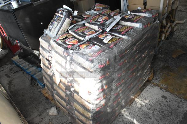120 bags of Cooks Charcoal Briquets on a pallet, shrink-wrapped, in a warehouse setting.
