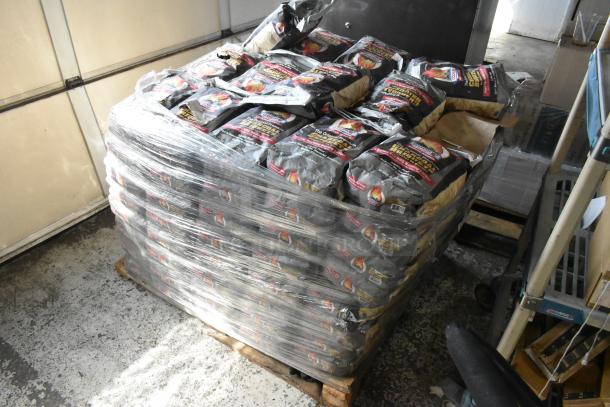 Pallet of 120 bags of Cooks charcoal briquets, wrapped in plastic, suitable for grilling or barbecue, in bulk.