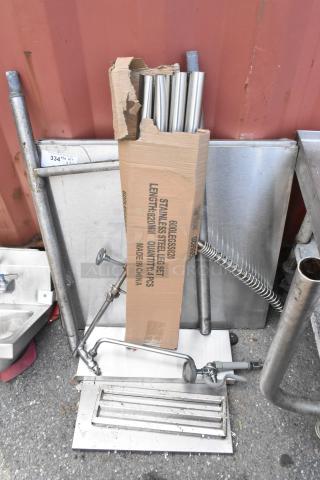 Lot of metal pieces and legs, including stainless steel tubes and a faucet. Box labeled "14 pcs, 820mm, Made in China."
