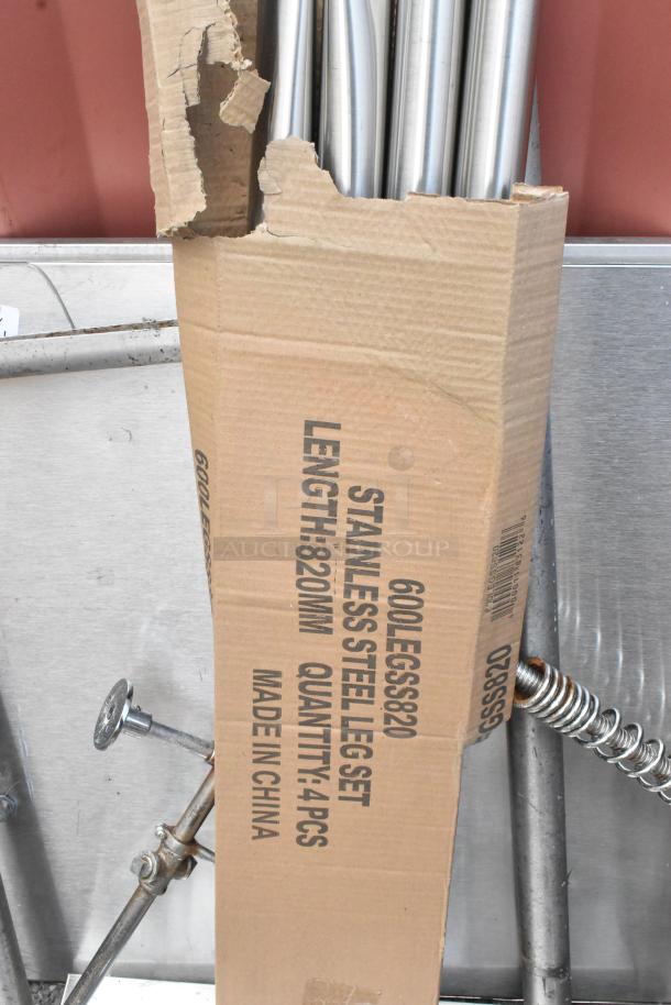 Cardboard box containing stainless steel legs, length 820mm, 4pcs, some scratches, marked "600LEGSS820" and "Made in China."