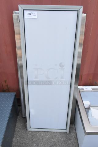 3 brand new scratch and dent items, including Watts WD-25 stainless steel doors, shown with protective frame and auction tag.