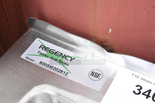 Brand new Regency 600SM202812 stainless steel mop sink with scratches, 16-gauge, 28"x20"x12" bowl, NSF certified.