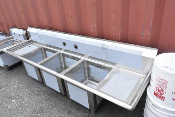 Regency 600S31515215 stainless steel 3-bay sink with dual drain boards, scratch and dent, no legs, new condition.