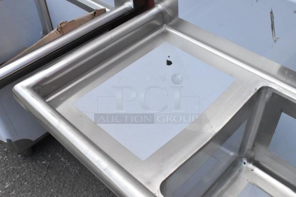 BRAND NEW Regency 600S31515215 stainless steel 3 bay sink with dual drain boards. Scratch and dent, no legs included.