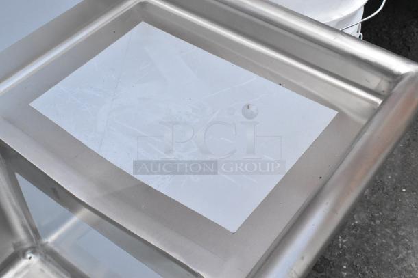 Stainless steel Regency 600S31515215 3-bay sink with dual drain boards, scratch and dent, no legs, brand new condition.