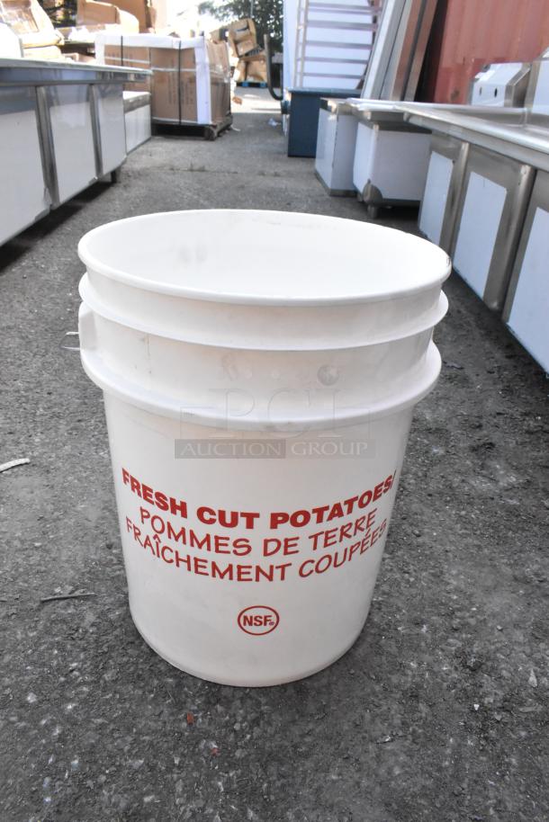 White poly bucket with red "Fresh Cut Potatoes" text, NSF label, and minor scratches. New condition, ideal for storage.