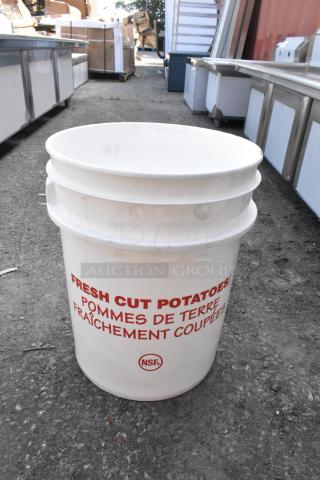 White poly bucket with red "Fresh Cut Potatoes" text, NSF label, and minor scratches. New condition, ideal for storage.