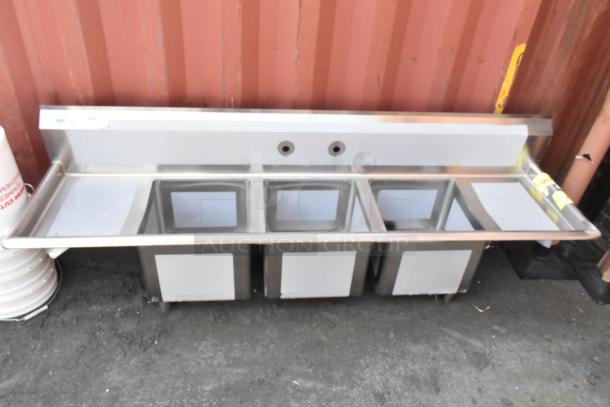 Regency 600S31515215 stainless steel 3 bay sink with dual drain boards, brand new with minor dents. No legs included.