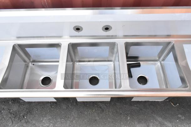 BRAND NEW Regency 600S31515215 stainless steel 3 bay sink with dual drain boards, no legs, minor scratches.