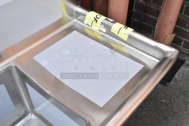 BRAND NEW SCRATCH AND DENT Regency 600S31515215 stainless steel 3-bay sink with dual drain boards; surface scratches visible.