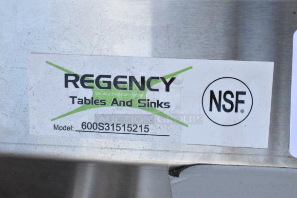 "New Regency 600S31515215 stainless steel 3-bay sink with dual drain boards. Scratch and dent, no legs. NSF certified."