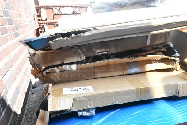 Stack of damaged boxes containing brand new scratch and dent items including stainless steel equipment. Tag reads "346".