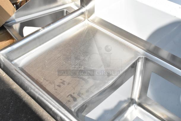 BRAND NEW Regency 600S31515215 stainless steel 3 bay sink with dual drain boards, no legs, scratch and dent condition.