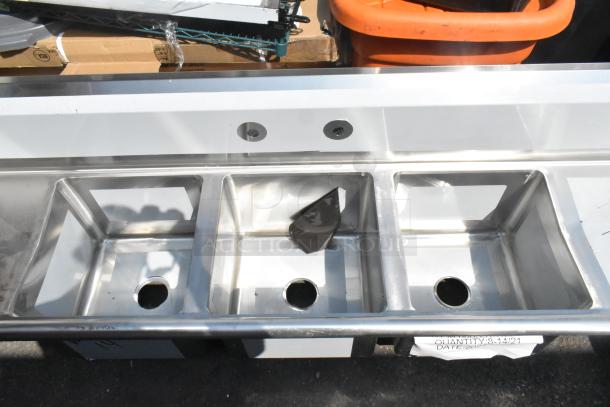 BRAND NEW Regency 600S31515215 stainless steel 3 bay sink, dual drain boards, no legs. Scratch and dent condition.