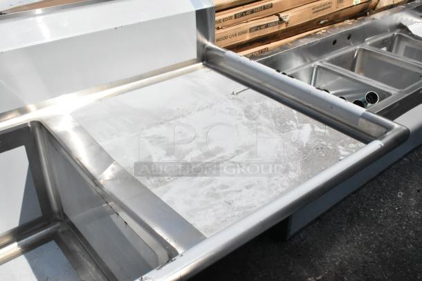 BRAND NEW Regency 600S3242424R stainless steel 3-bay sink with right side drain board, slight scratches, no legs.