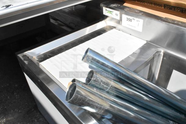 BRAND NEW Regency 3 Bowl Underbar Sink, 60" x 18 3/4", two drainboards, slight dents. Tags indicate NSF certification.