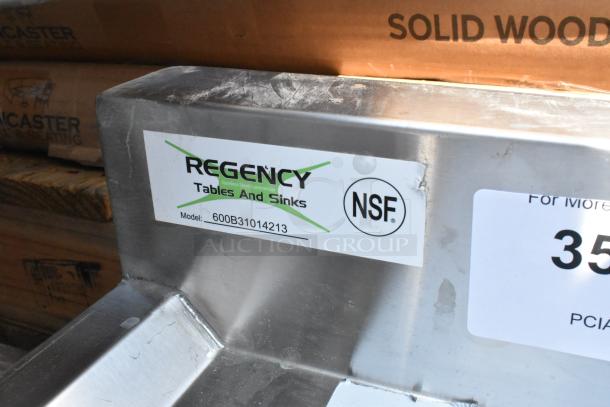 Brand new Regency 3-bowl underbar sink with scratches; Model 600B31014213; includes two drainboards; NSF certified.