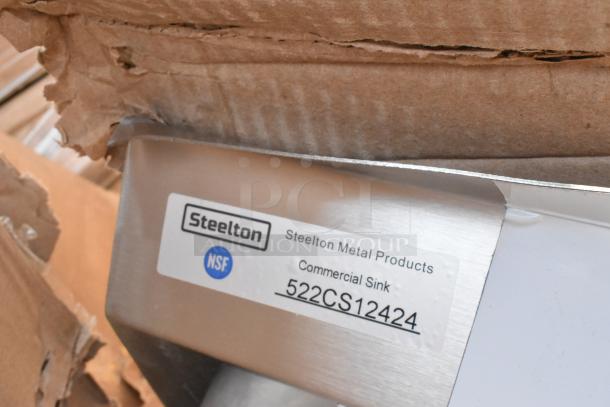Steelton Metal Products commercial sink, model 522CS12424, brand new with scratch and dent, NSF certified label visible.