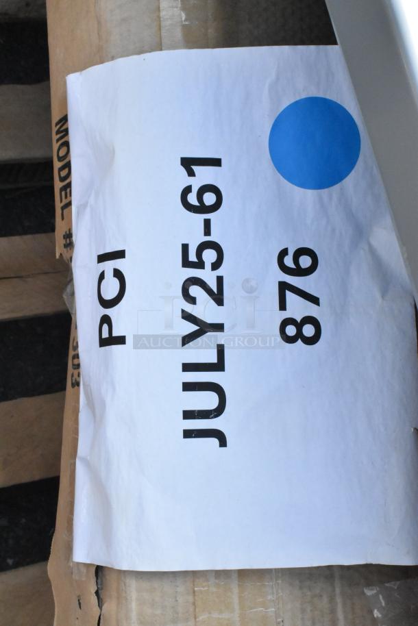 White label with "PCI JULY25-61 876" text, blue dot. Attached to cardboard and possibly stainless steel equipment stands.