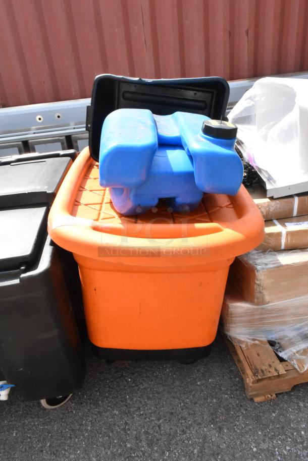Three storage items: blue container, black bus bin on wheels, and orange bin. Used, outdoors. Auction lot: 3 items per bid.