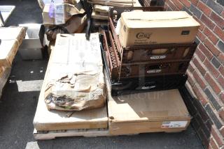 Ten items including wire shelves and ergonomic platform truck in various boxes, some marked "Baker's Lane," labeled "scratch and dent."
