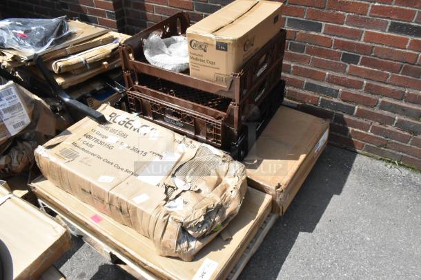 Stacked unopened boxes of new items, including Choice medicine cups and Regency items, labeled as scratch and dent.