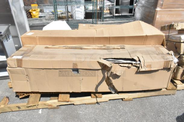 Damaged box on a wooden pallet containing 3 brand new scratch and dent items, including Regency Locker Systems.