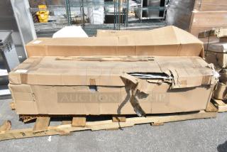 Damaged box on a wooden pallet containing 3 brand new scratch and dent items, including Regency Locker Systems.