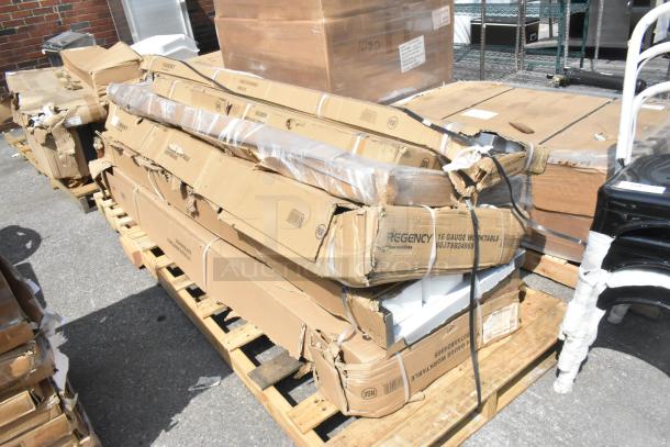 New scratch and dent lot includes Regency stainless steel overshelf and work tables, in damaged boxes on pallet.