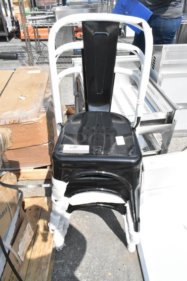Black metal Tolix style dining chair, new condition, minor scratches and dents, protective wrap on legs.