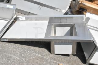 BRAND NEW Regency 600ST2448R 24"x48" stainless steel work table with sink, no legs, minor scratches, and dents, NSF certified.