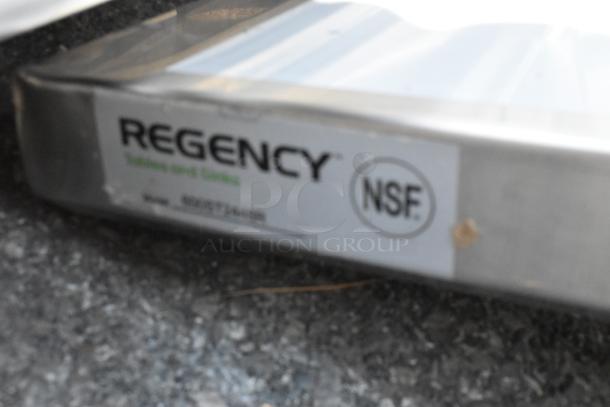 Brand new Regency 600ST2448R stainless steel work table with sink, 24"x48", 16 gauge, no legs, minor scratches, NSF certified.