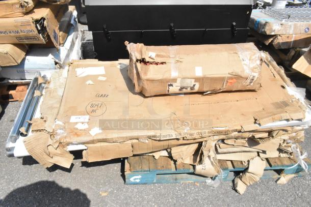 Eight new scratch and dent items, including a tabletop and stainless equipment stand, in worn packaging. Marked "Clark 8047 M."