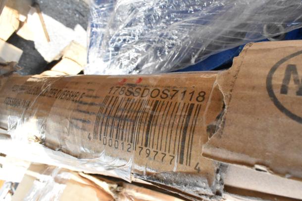 A cardboard box with the label "178SSDOS7118" and barcode, indicating stainless overshelf. Box is slightly damaged.