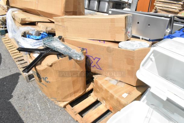 Boxes containing 7 brand new scratch and dent items, including cleaning brushes and trash cans, on a pallet.