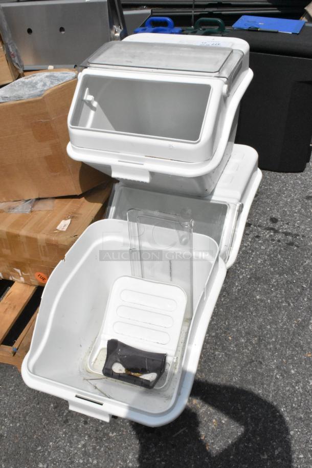 Three brand new white poly ingredient bins with minor scratches and dents, stackable design with clear sliding lids.
