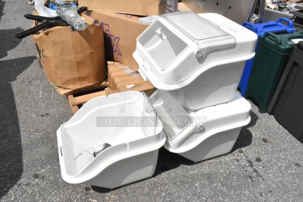 Three brand new white poly ingredient bins with minor scratches and dents, featuring flip-top lids, stacked outdoors.